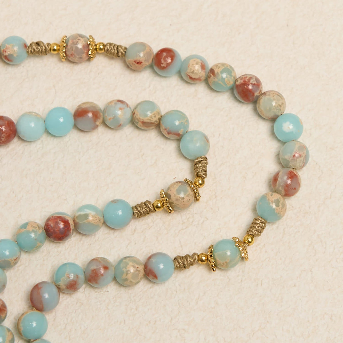 Aqua Stone Prayer Rosary with Gold Accents: A Divine Source of Peace and Devotion