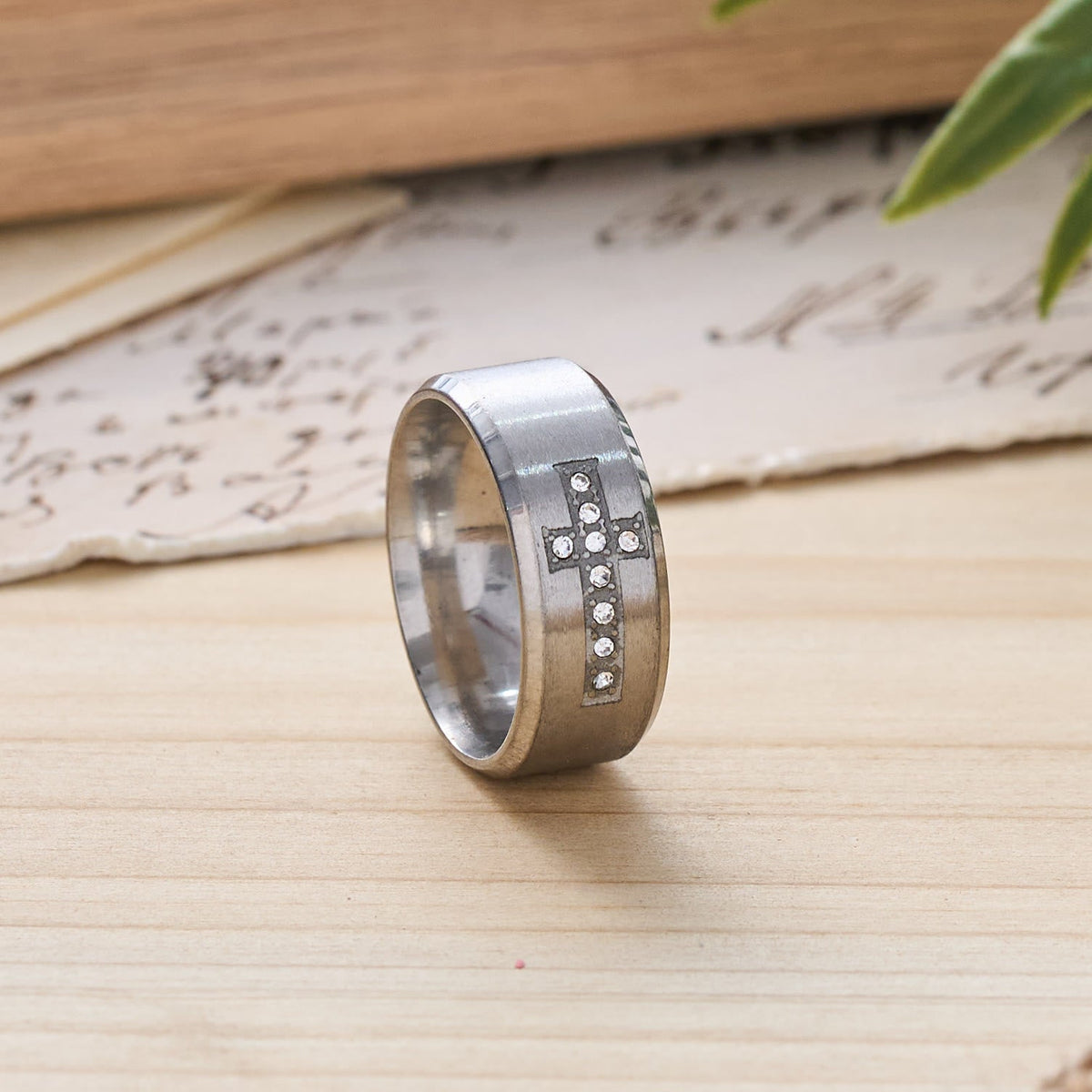 Sleek Wide Band Jeweled Cross Ring: Token of Calming Divine Guidance