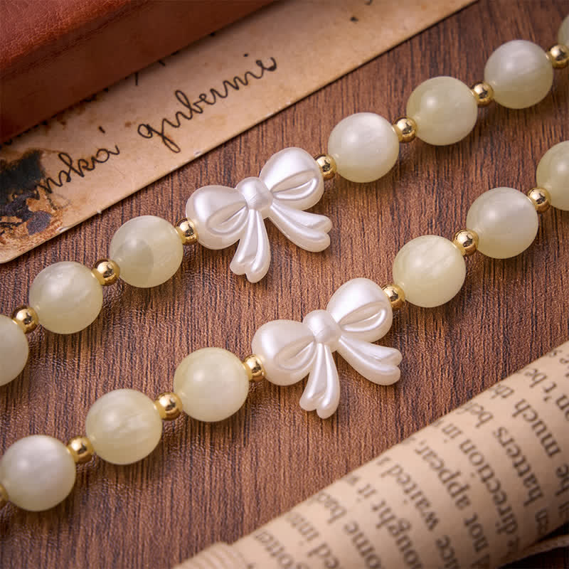 Pale Green Cat's Eye Resin Bow Rosary With Gilded Cross: Emblem of Soft Heavenly Grace