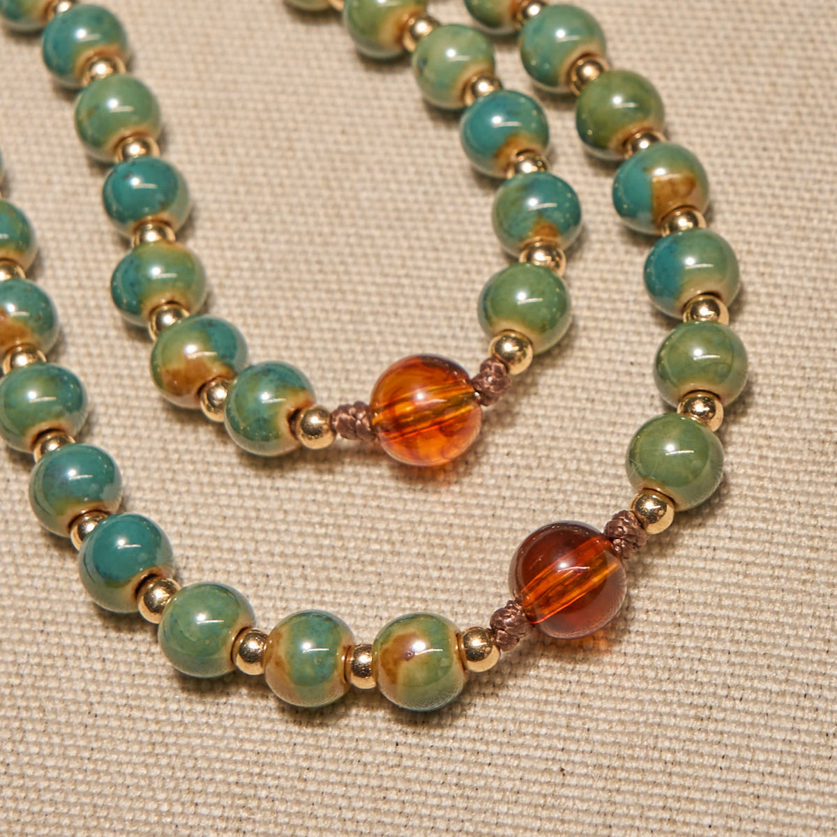 PRAYERFUL FAITH: Handcrafted Green Ceramic Rosary with Amber Beads
