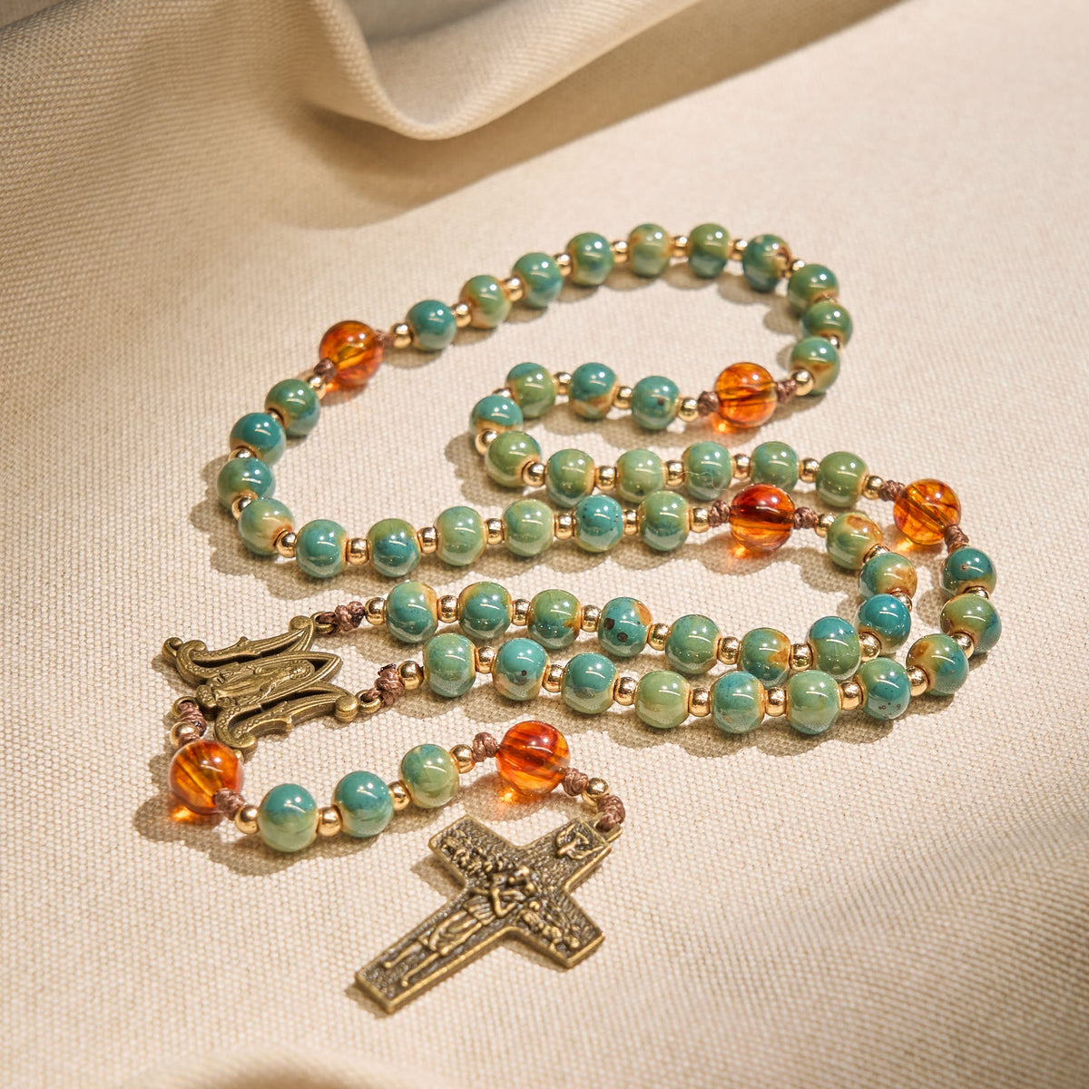 PRAYERFUL FAITH: Handcrafted Green Ceramic Rosary with Amber Beads
