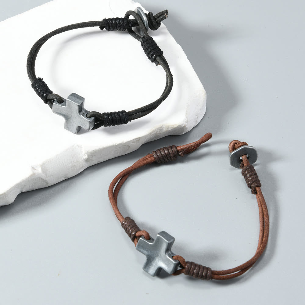 Antiqued Metal Cross on Braided Leather Cord: An Emblem of Steadfast Belief
