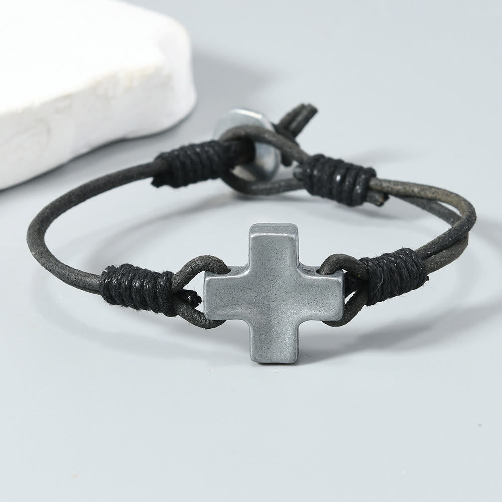 Antiqued Metal Cross on Braided Leather Cord: An Emblem of Steadfast Belief