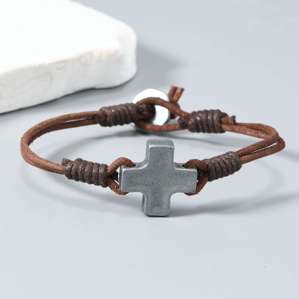 Antiqued Metal Cross on Braided Leather Cord: An Emblem of Steadfast Belief