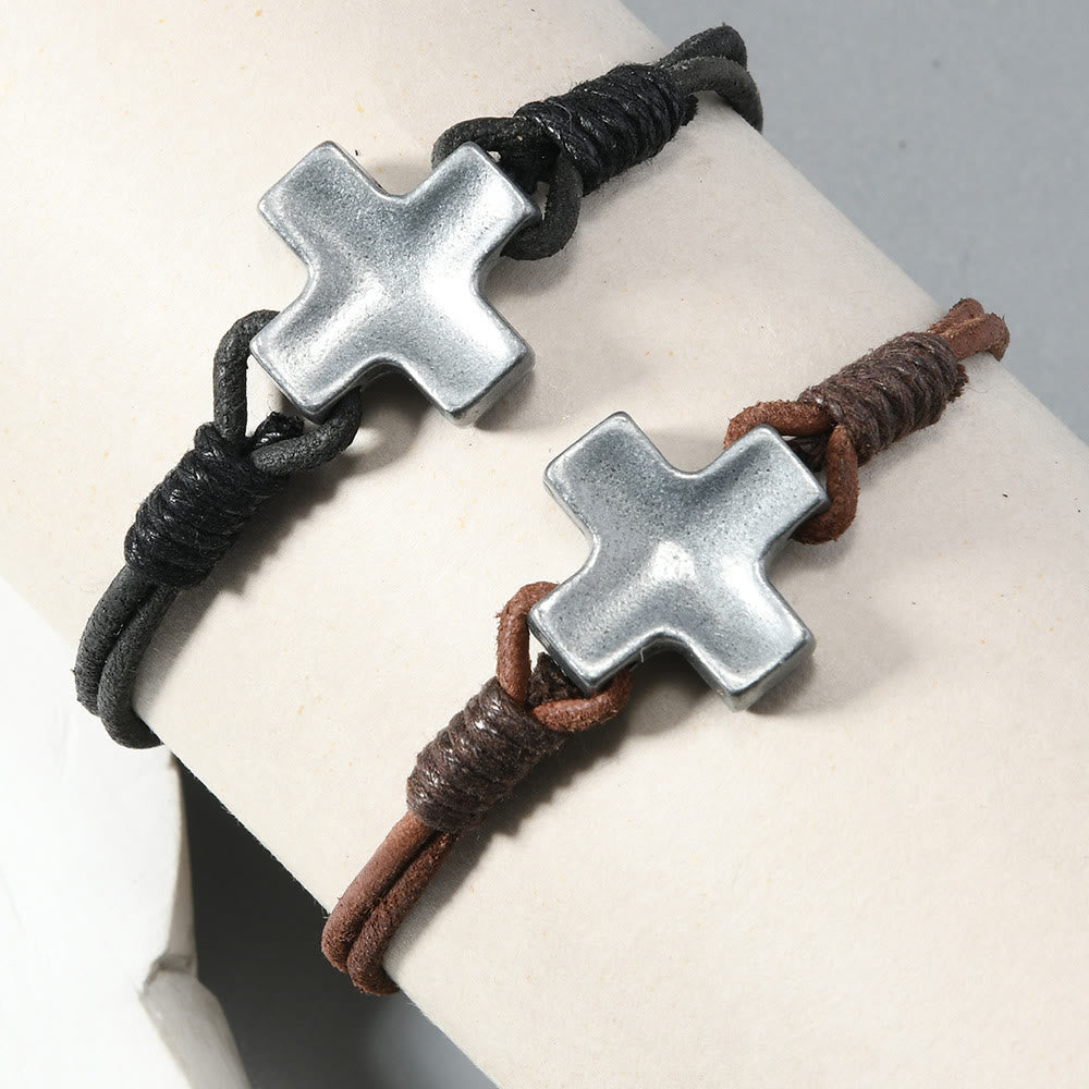 Antiqued Metal Cross on Braided Leather Cord: An Emblem of Steadfast Belief
