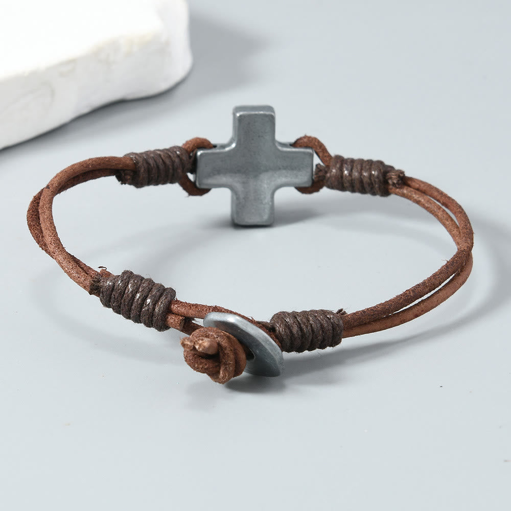 Antiqued Metal Cross on Braided Leather Cord: An Emblem of Steadfast Belief
