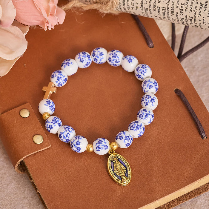 Vintage-Style Floral Ceramic Bead Bracelet with Cross & Mary Medal: A Reminder of Divine Grace