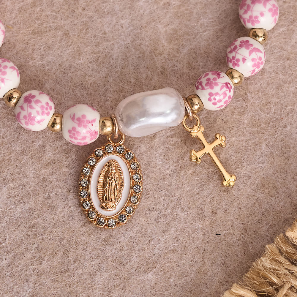 Blue/Pink Floral Ceramic Bead Bracelet with Large White Accent Bead: A Reminder of Divine Grace