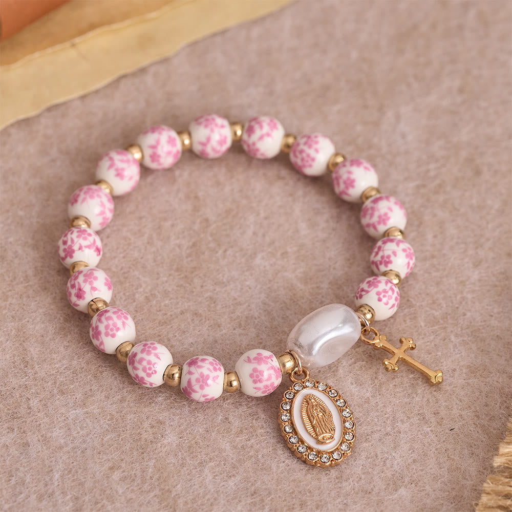 Blue/Pink Floral Ceramic Bead Bracelet with Large White Accent Bead: A Reminder of Divine Grace
