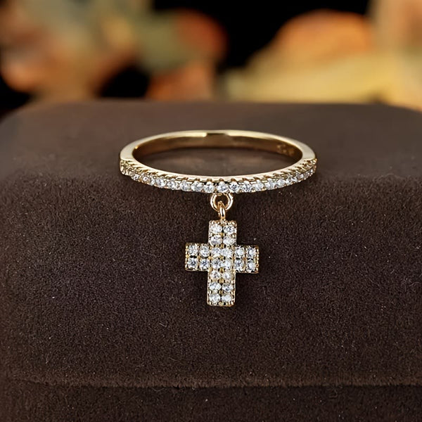 Eternity Band Cross Ring with Dangling Zirconia Cross Charm: A Reminder of Divine Light