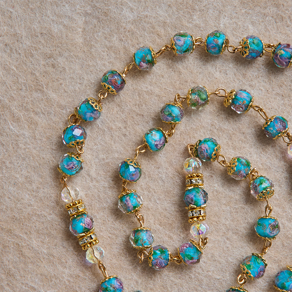 Blue Floral Glass Rosary With Rose Gilded Crucifix & Our Lady of Guadalupe Medallion