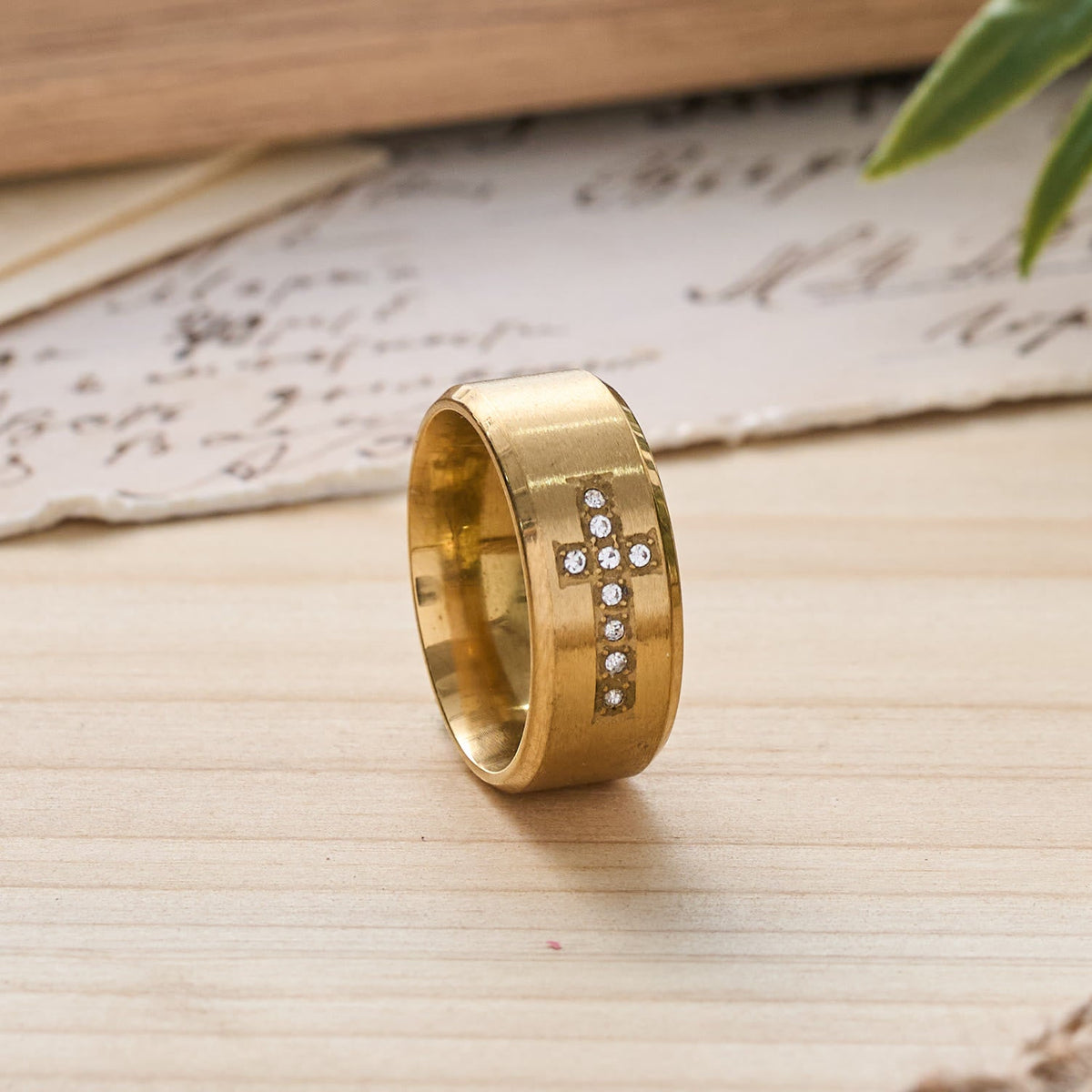 Sleek Wide Band Jeweled Cross Ring: Token of Calming Divine Guidance